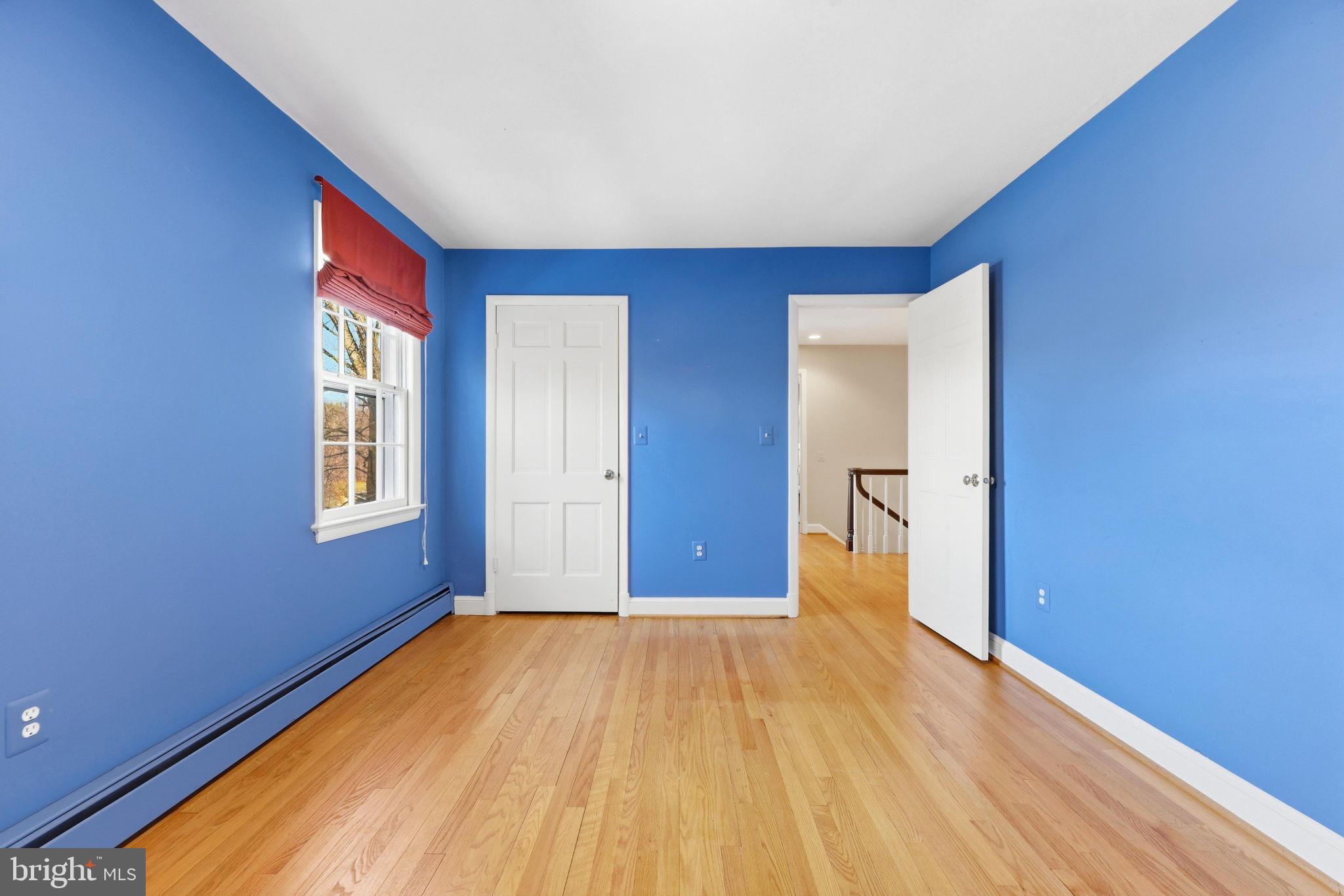 9101 Warfield Road Gaithersburg, MD 20882 - Photo 31 of 44 a view of empty room with wooden floor