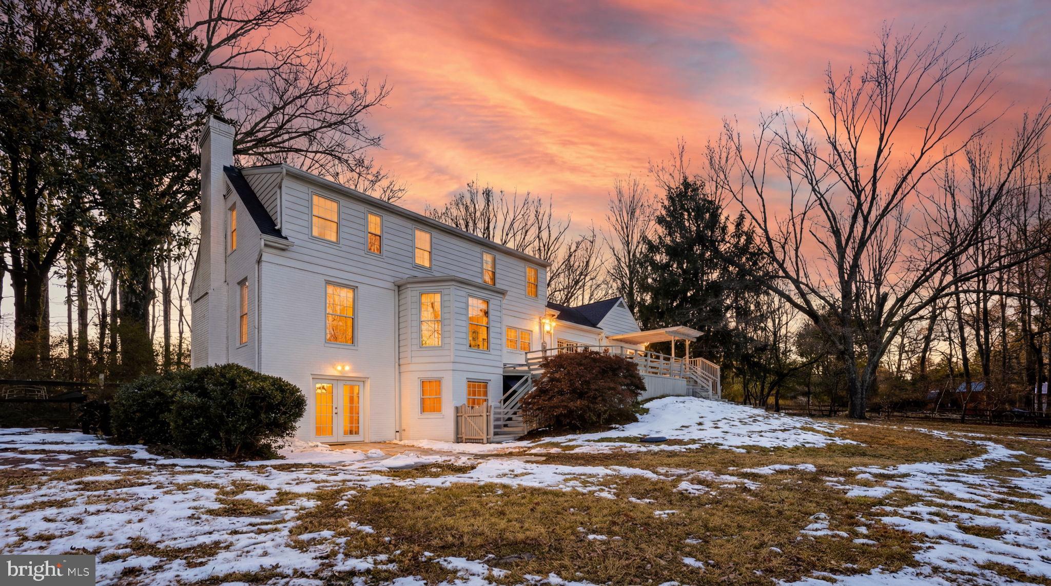 9101 Warfield Road Gaithersburg, MD 20882 - Photo 34 of 44 a front view of a house with a yard