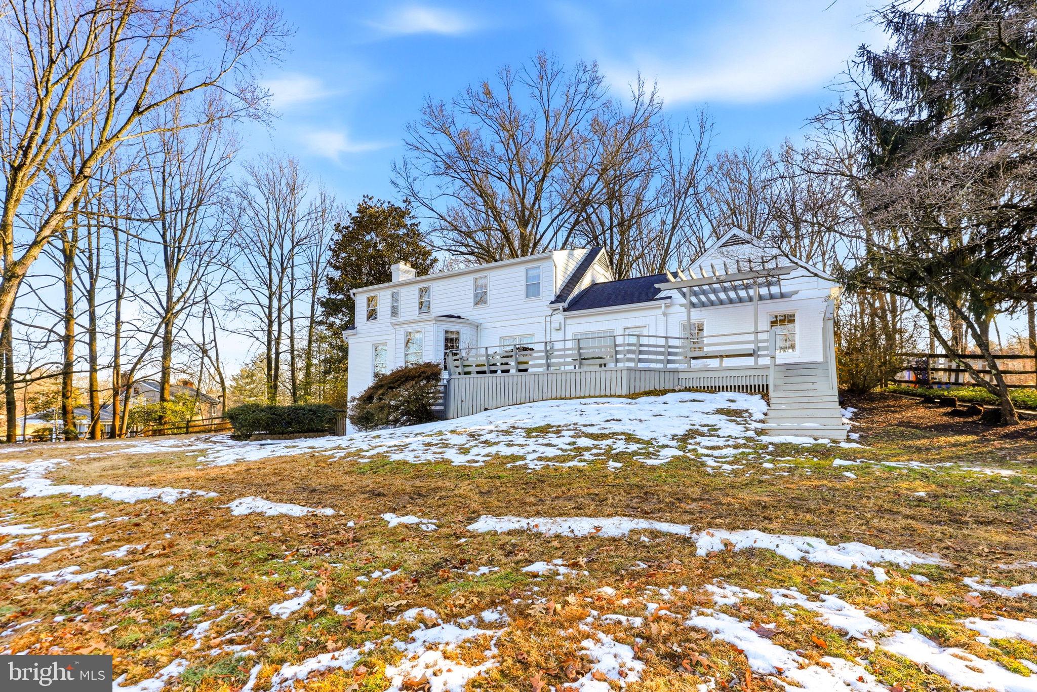 9101 Warfield Road Gaithersburg, MD 20882 - Photo 36 of 44 a view of a yard with a snow