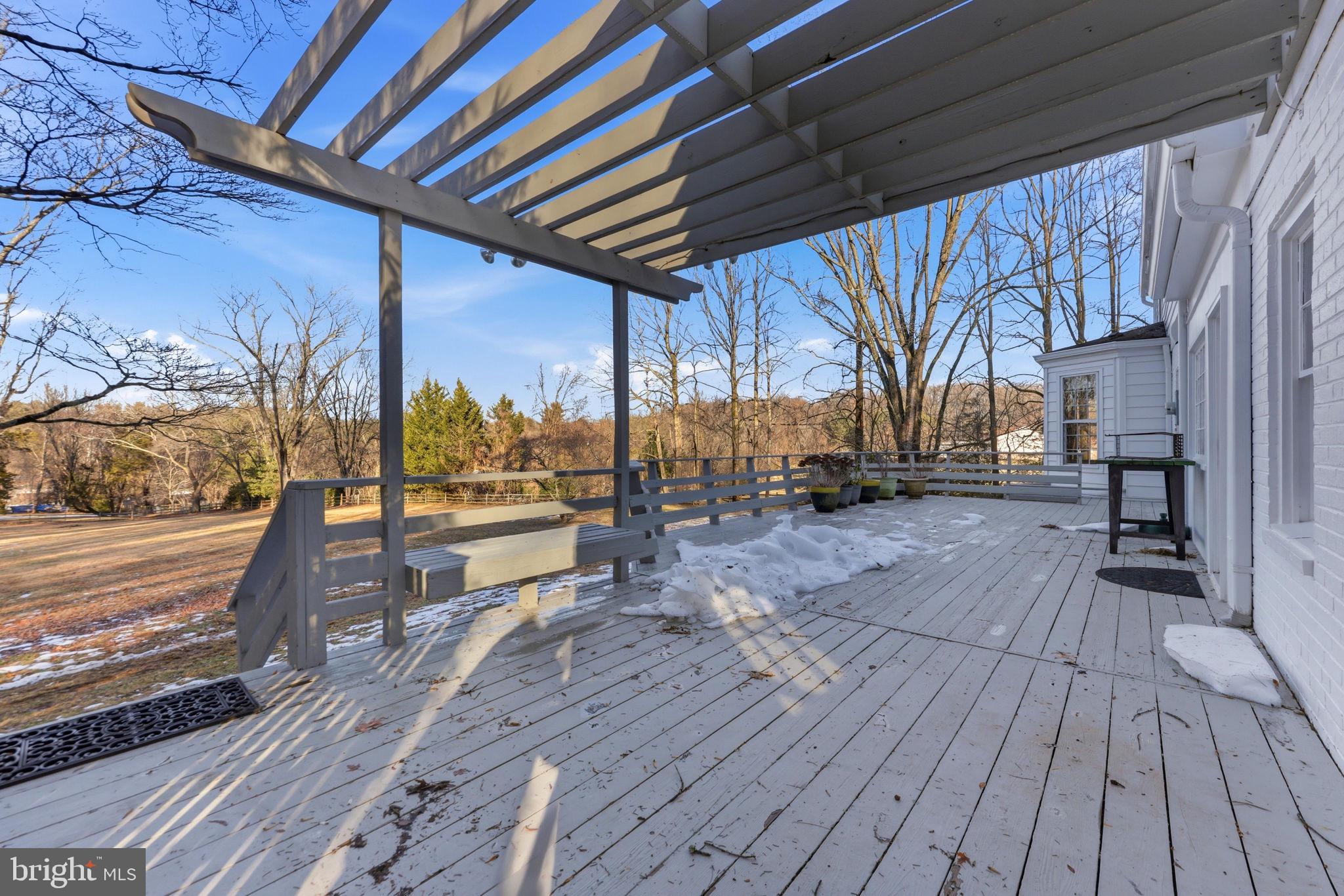 9101 Warfield Road Gaithersburg, MD 20882 - Photo 37 of 44 a view of a balcony with wooden floor