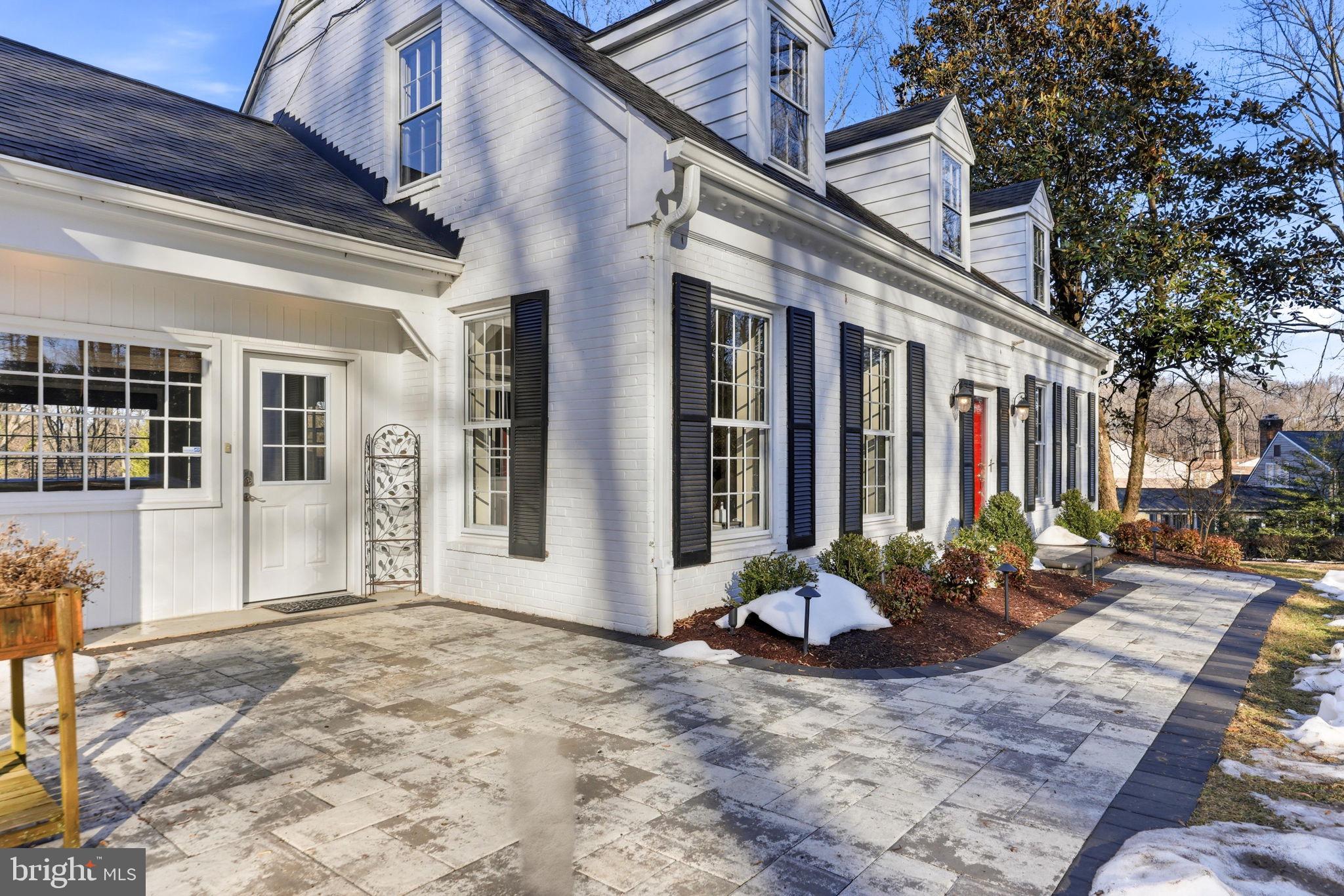9101 Warfield Road Gaithersburg, MD 20882 - Photo 9 of 44 a view of a building with potted plants