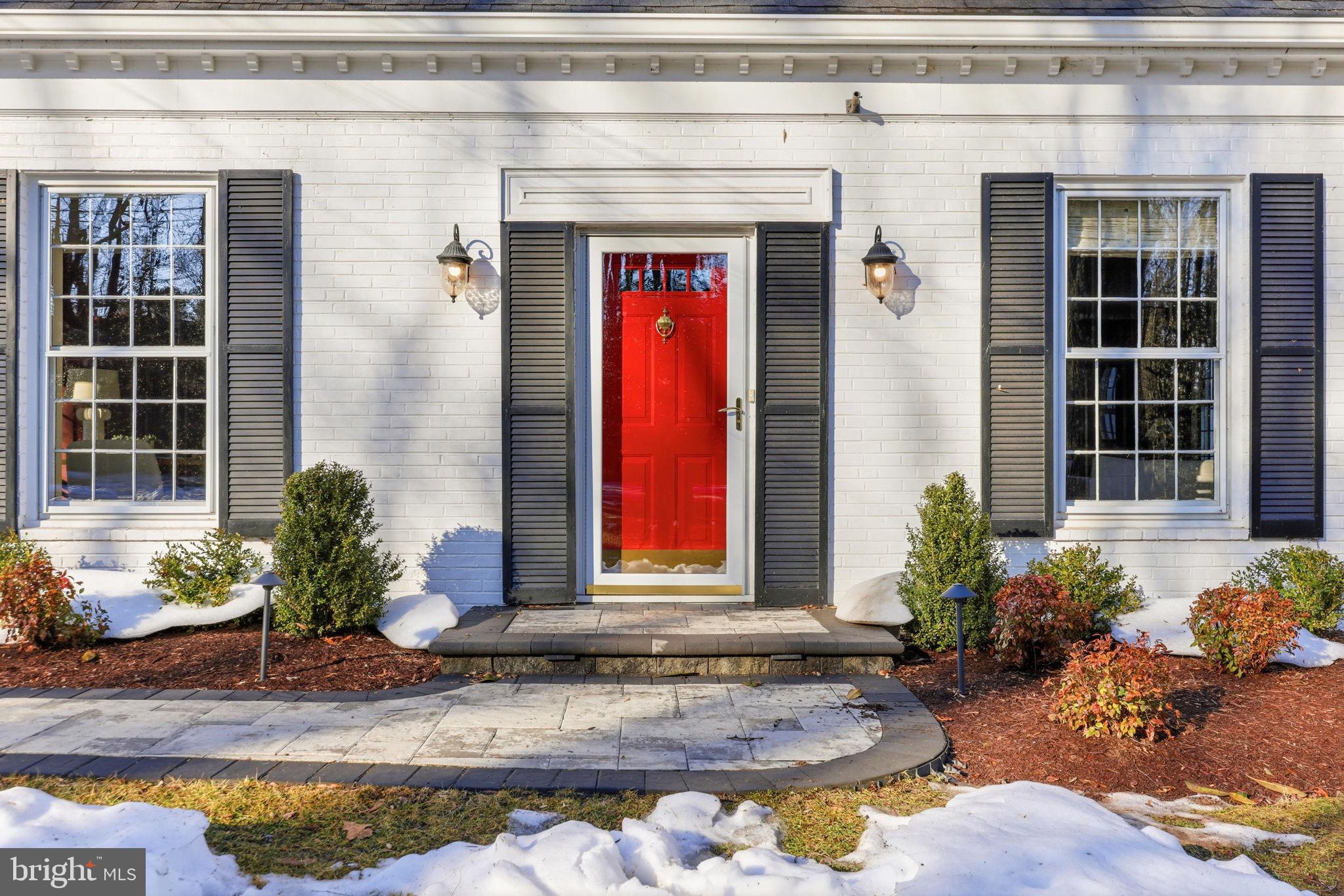 9101 Warfield Road Gaithersburg, MD 20882 - Photo 10 of 44 a front view of a house with a yard