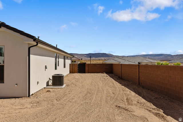 2955 East Rimrunner Drive St. George, UT 84790 - Photo 32 of 35 Expansive undeveloped yard space with a sturdy block wall perimeter