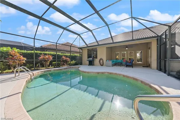 a view of a swimming pool with a patio