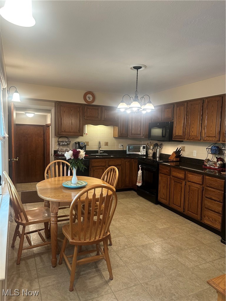 379 Wilson Mills Road Chardon, OH 44024 - Photo 3 of 20 Kitchen with stove, a sink, granite countertops