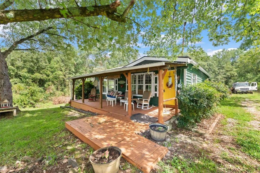 1542 Marlow Road Maysville, GA 30558 - Photo 3 of 35 a view of a house with backyard porch and sitting area