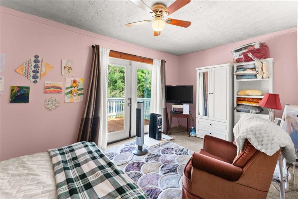 1542 Marlow Road Maysville, GA 30558 - Photo 9 of 35 a bedroom with furniture or couch and a window