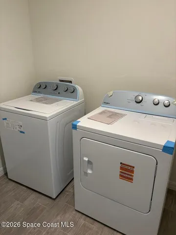 a utility room with dryer and washer