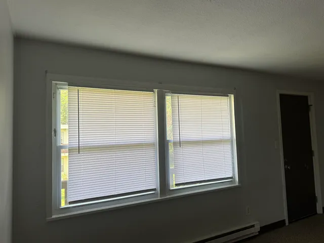 a view of an empty room with a window