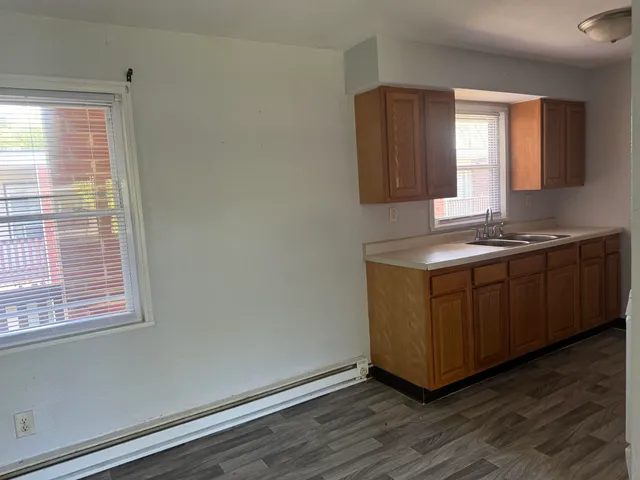 a room with a window and wooden floor