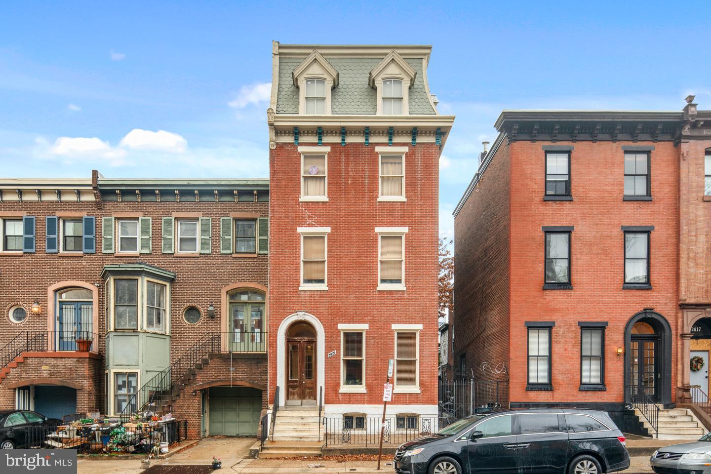 2021 Spring Garden Street, Unit 3F Philadelphia, PA 19130 - Photo 1 of 22 a front view of a building with parking space