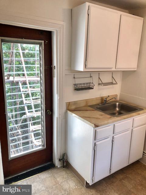 2021 Spring Garden Street, Unit 3F Philadelphia, PA 19130 - Photo 15 of 22 a view of a kitchen with a sink and cabinets