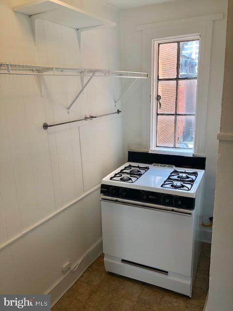 2021 Spring Garden Street, Unit 3F Philadelphia, PA 19130 - Photo 16 of 22 a stove top oven sitting inside of a kitchen