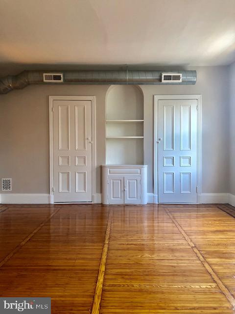 2021 Spring Garden Street, Unit 3F Philadelphia, PA 19130 - Photo 9 of 22 a view of empty room with wooden floor and cabinet