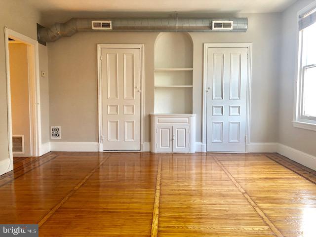 2021 Spring Garden Street, Unit 3F Philadelphia, PA 19130 - Photo 10 of 22 a view of an empty room with window and wooden floor