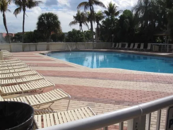 a view of swimming pool from a balcony