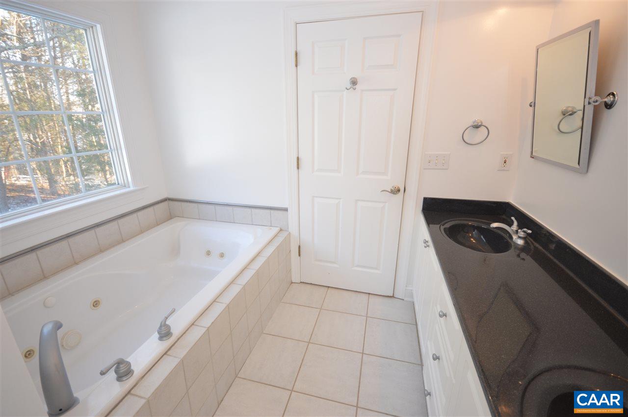 3308 Welsh Run Road Ruckersville, VA 22968 - Photo 15 of 39 a bathroom with a bathtub and a shower