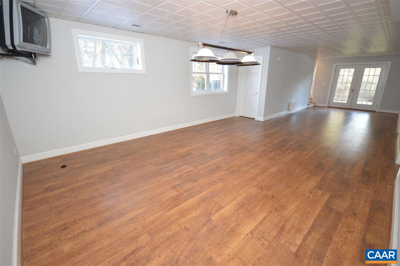 3308 Welsh Run Road Ruckersville, VA 22968 - Photo 18 of 39 a view of empty room with wooden floor and fan