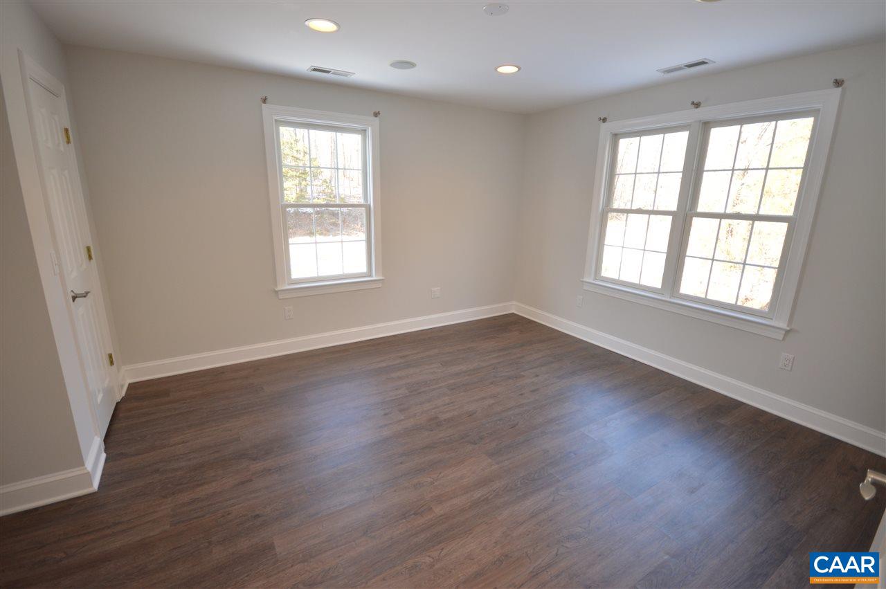 3308 Welsh Run Road Ruckersville, VA 22968 - Photo 24 of 39 an empty room with wooden floor and windows