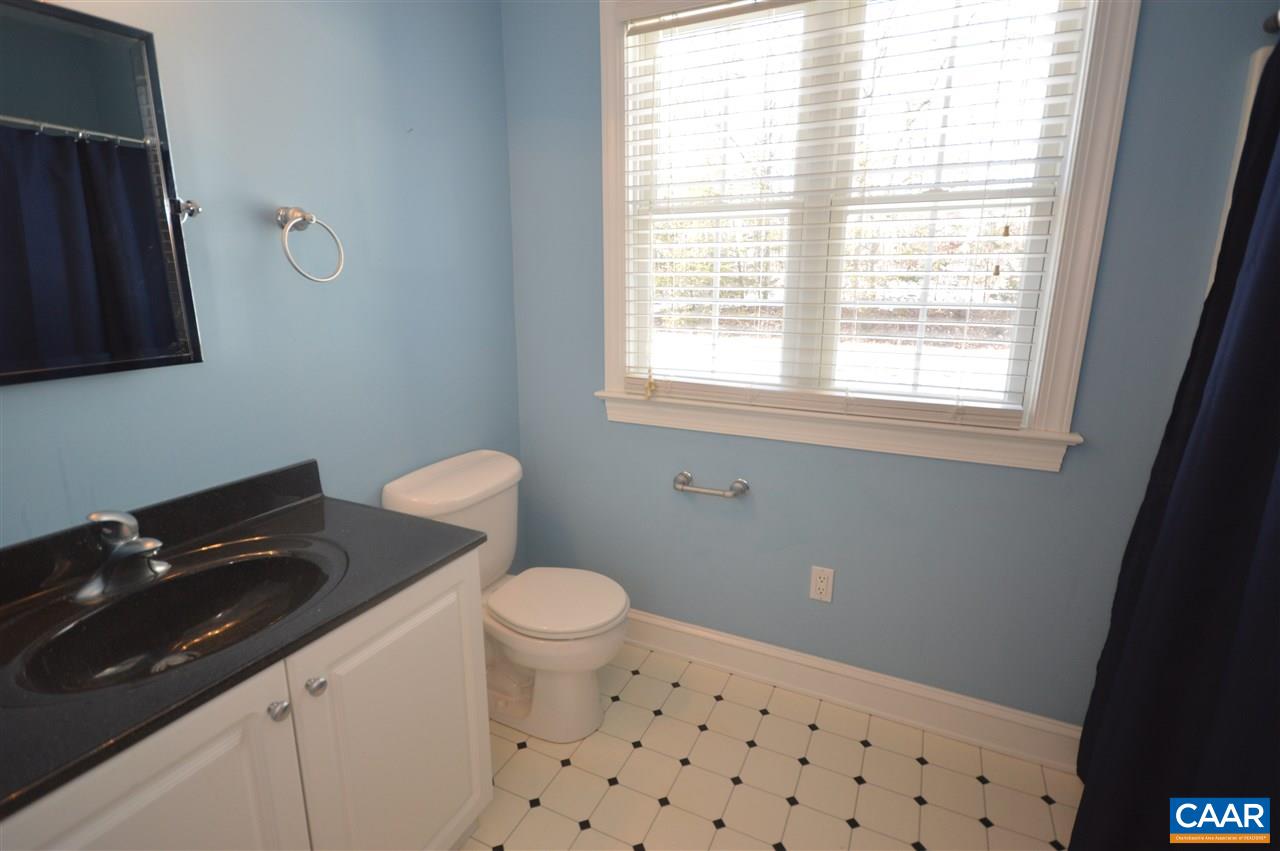 3308 Welsh Run Road Ruckersville, VA 22968 - Photo 26 of 39 a bathroom with a sink toilet and window
