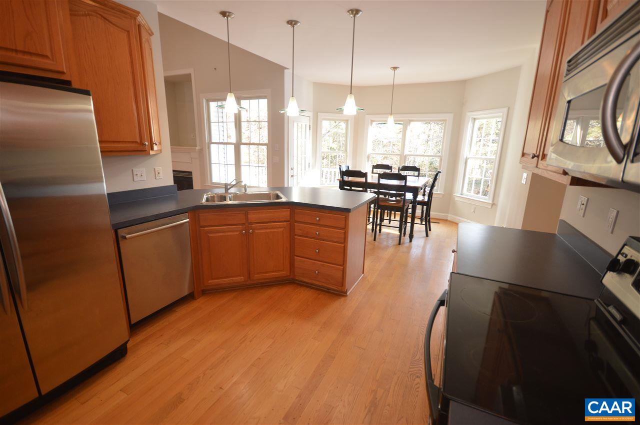 3308 Welsh Run Road Ruckersville, VA 22968 - Photo 7 of 39 a kitchen with stainless steel appliances granite countertop sink stove refrigerator and cabinets