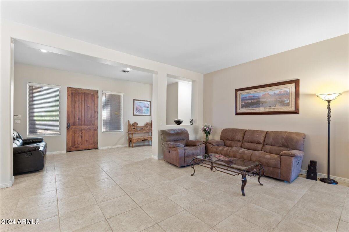 1706 West Parsons Road Phoenix, AZ 85085 - Photo 19 of 58 a living room with furniture and a couch