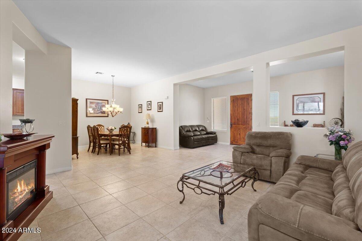 1706 West Parsons Road Phoenix, AZ 85085 - Photo 23 of 58 a living room with furniture and a fireplace