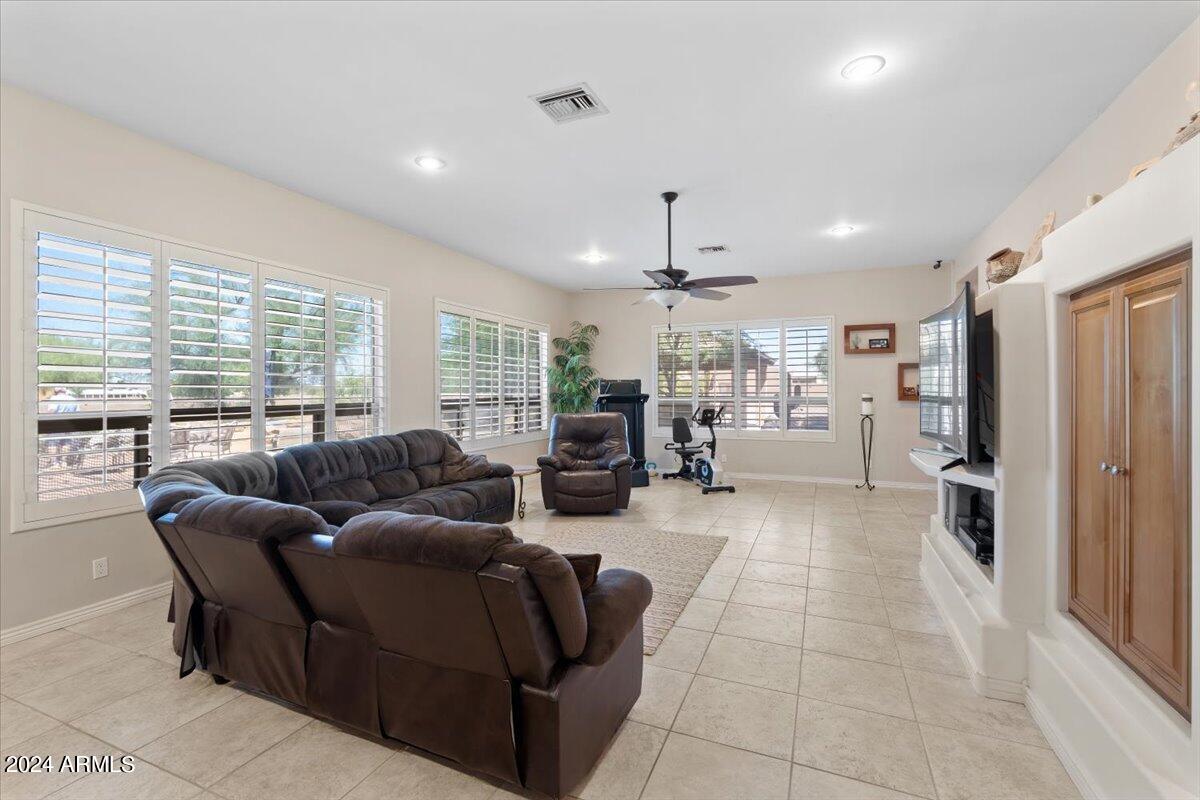 1706 West Parsons Road Phoenix, AZ 85085 - Photo 30 of 58 a living room with furniture and a large window