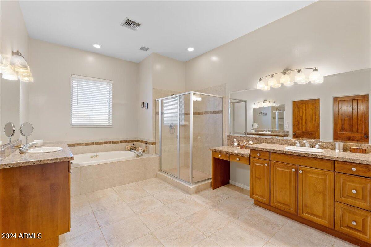 1706 West Parsons Road Phoenix, AZ 85085 - Photo 35 of 58 a large bathroom with a large tub sink vanity granite and shower