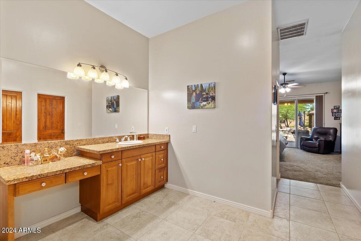 1706 West Parsons Road Phoenix, AZ 85085 - Photo 37 of 58 a view of a kitchen with stainless steel appliances granite countertop a stove and a view of living room