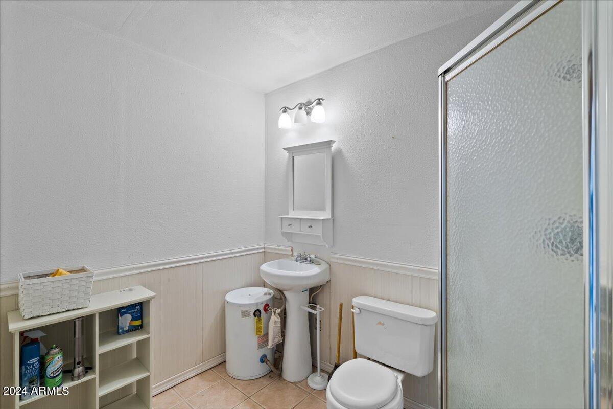 1706 West Parsons Road Phoenix, AZ 85085 - Photo 49 of 58 a bathroom with a toilet