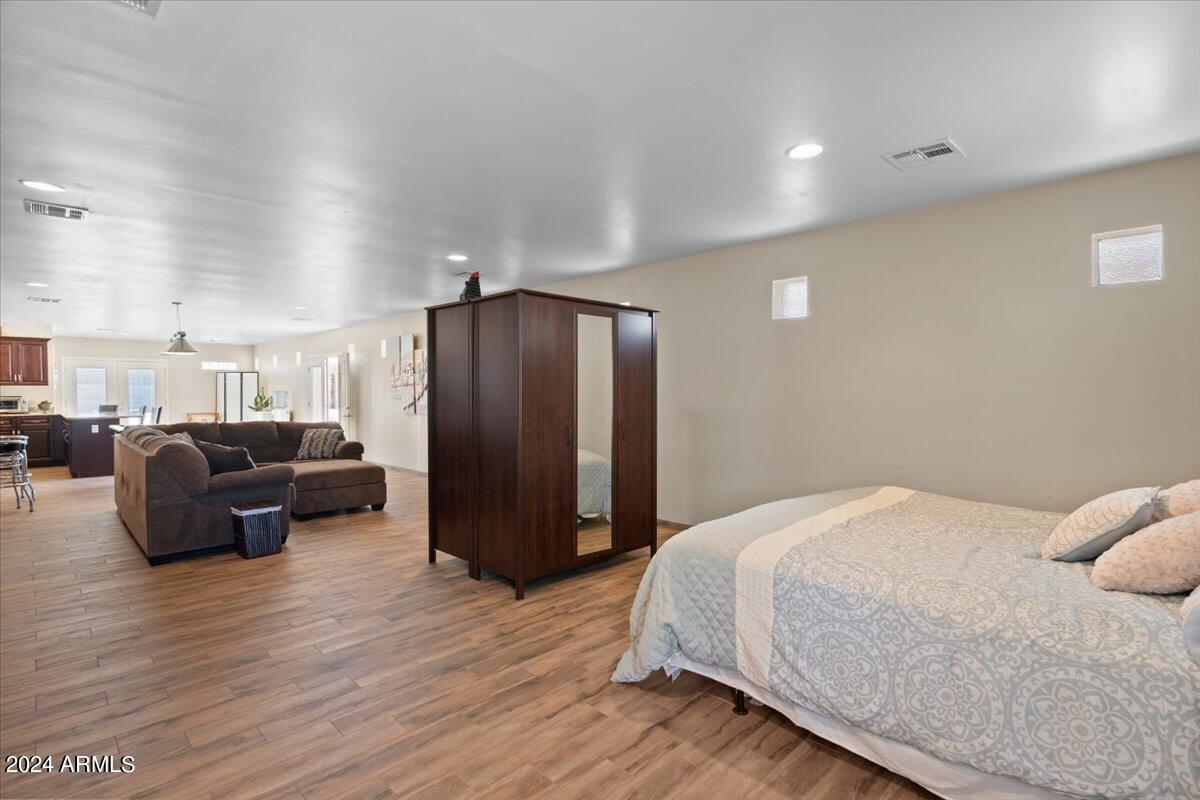 1706 West Parsons Road Phoenix, AZ 85085 - Photo 56 of 58 a spacious bedroom with a bed and furniture
