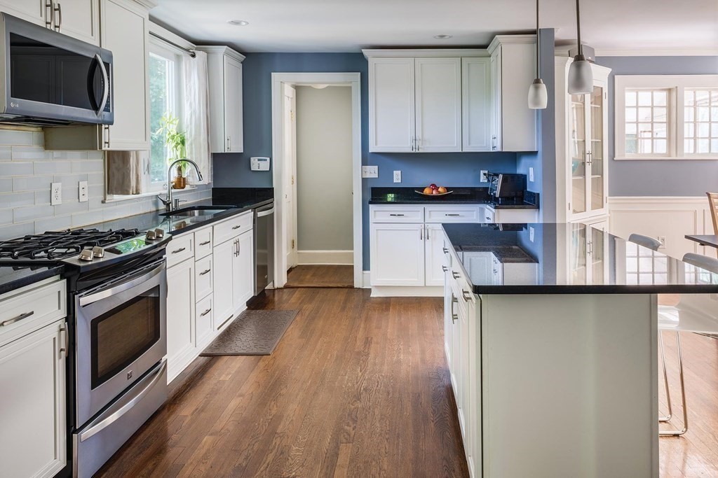 58 Pine Crest Road Newton, MA 02459 - Photo 5 of 17 a kitchen with stainless steel appliances granite countertop a stove a sink and a microwave
