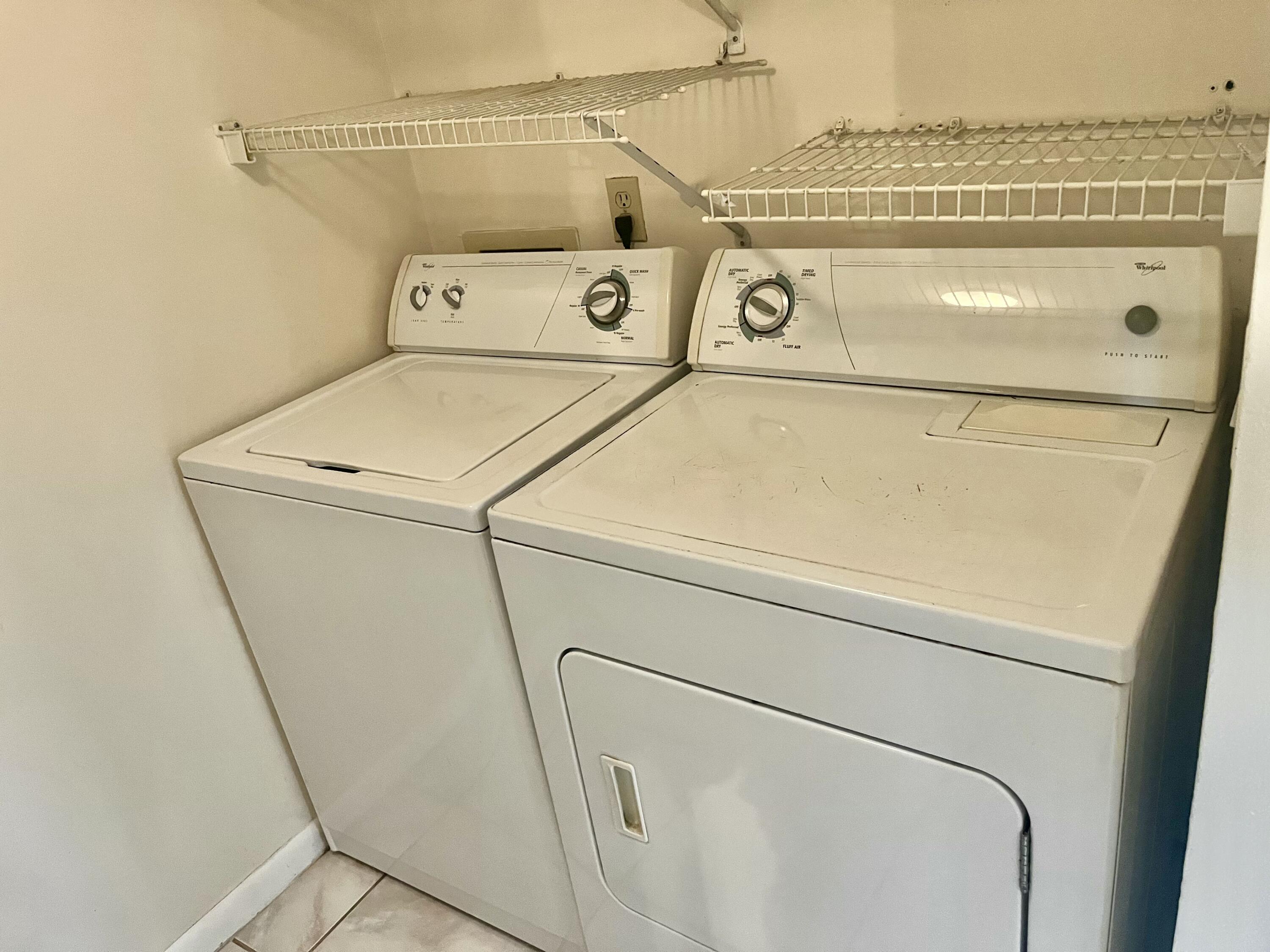 536 Shady Pine Way, Unit C2 Greenacres, FL 33415 - Photo 14 of 28 a utility room with dryer and washer