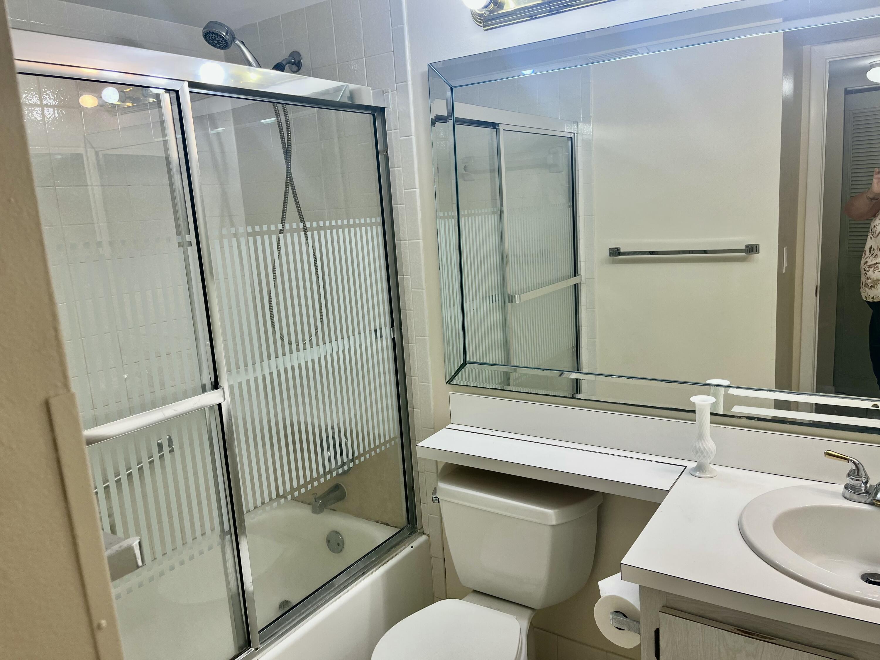 536 Shady Pine Way, Unit C2 Greenacres, FL 33415 - Photo 20 of 28 a bathroom with a sink toilet and shower