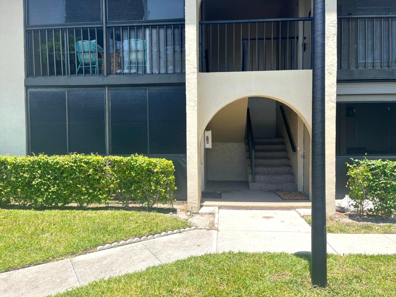536 Shady Pine Way, Unit C2 Greenacres, FL 33415 - Photo 3 of 28 a view of front door and porch