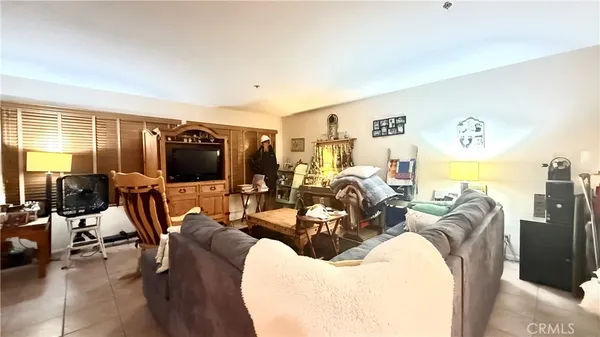 a view of a livingroom with furniture and a flat screen tv