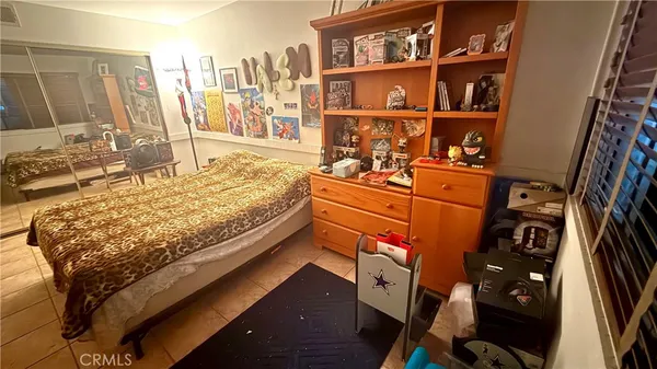 a bed room with a bed and a book shelf