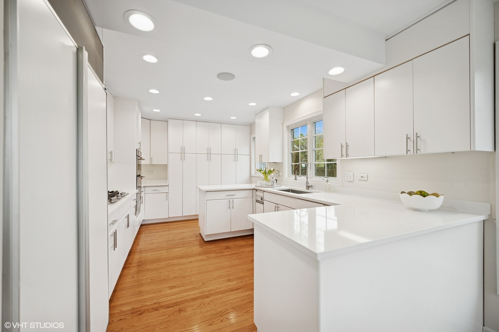770 Prospect Avenue Winnetka, IL 60093 - Photo 12 of 50 a kitchen with white cabinets and white appliances