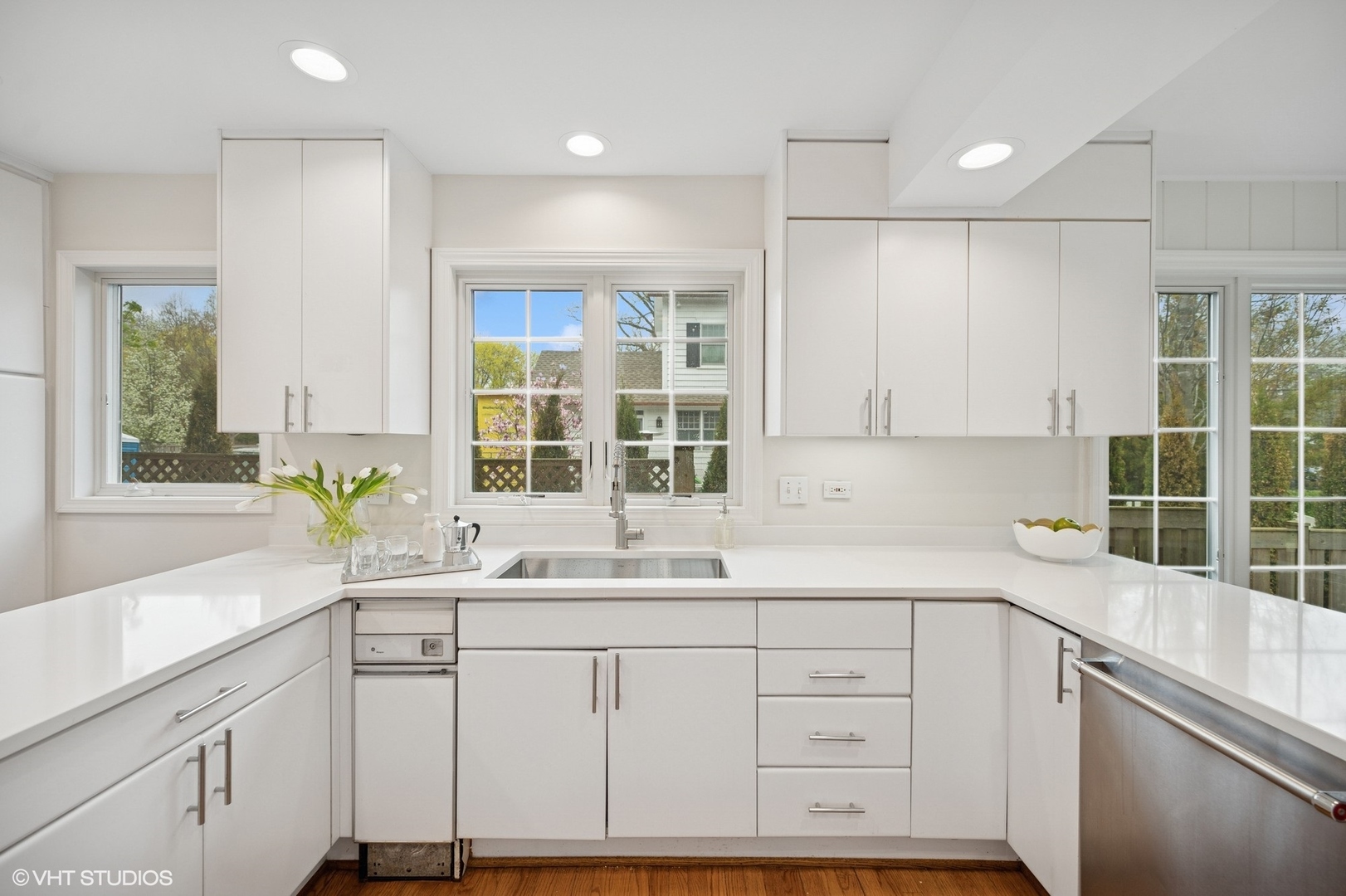 770 Prospect Avenue Winnetka, IL 60093 - Photo 13 of 50 a kitchen with a sink window and cabinets
