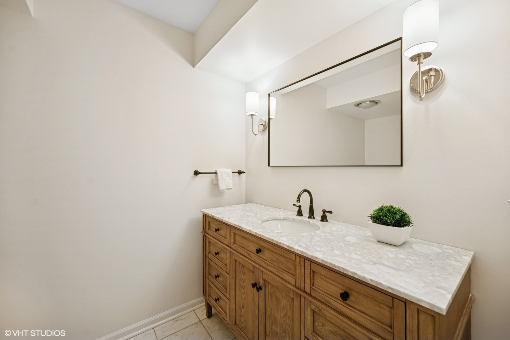 770 Prospect Avenue Winnetka, IL 60093 - Photo 16 of 50 a bathroom with a sink and a mirror