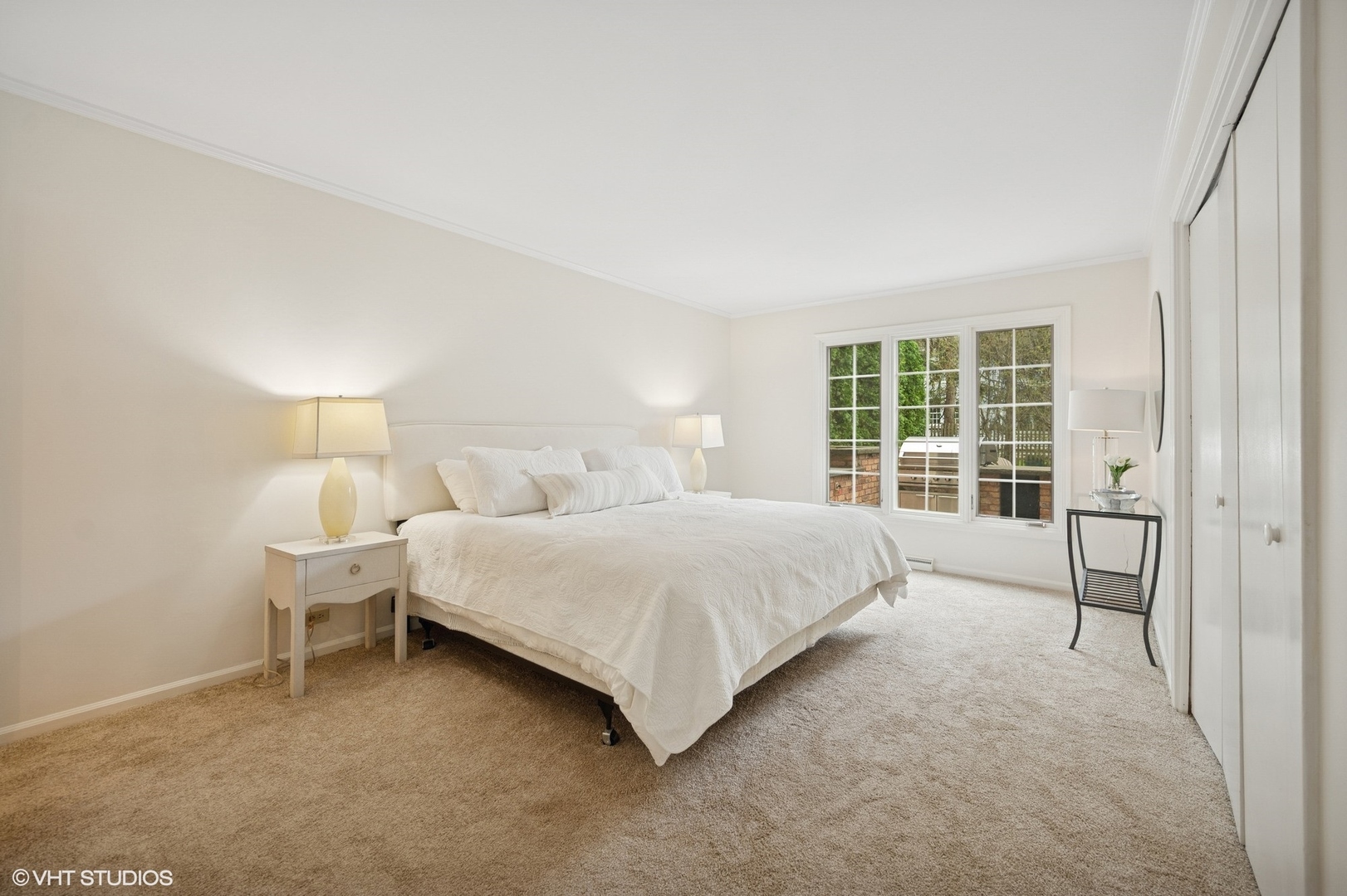 770 Prospect Avenue Winnetka, IL 60093 - Photo 17 of 50 a large bed sitting in a bedroom next to a window and lamp