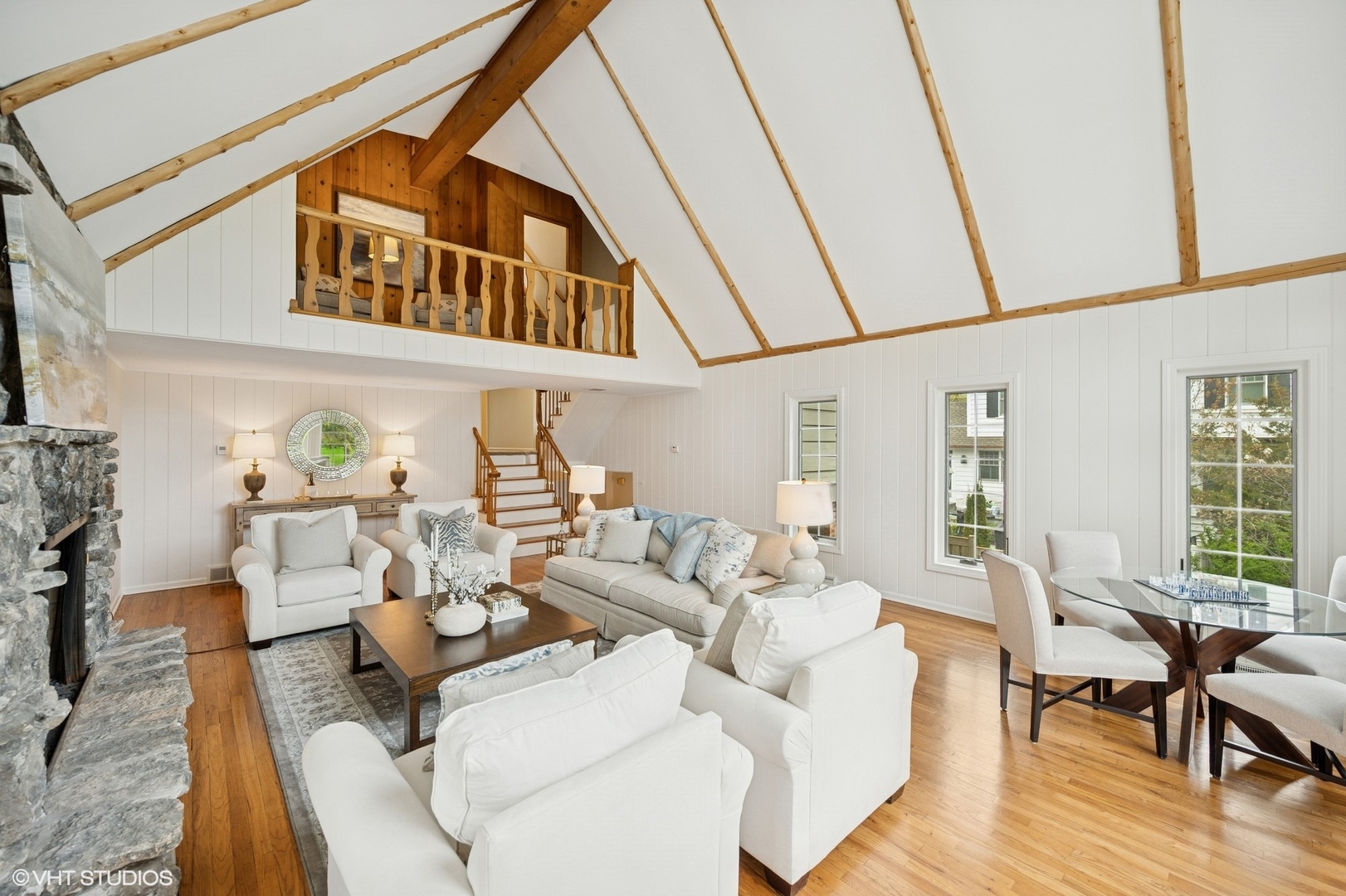 770 Prospect Avenue Winnetka, IL 60093 - Photo 20 of 50 a living room with furniture a fireplace and a large window