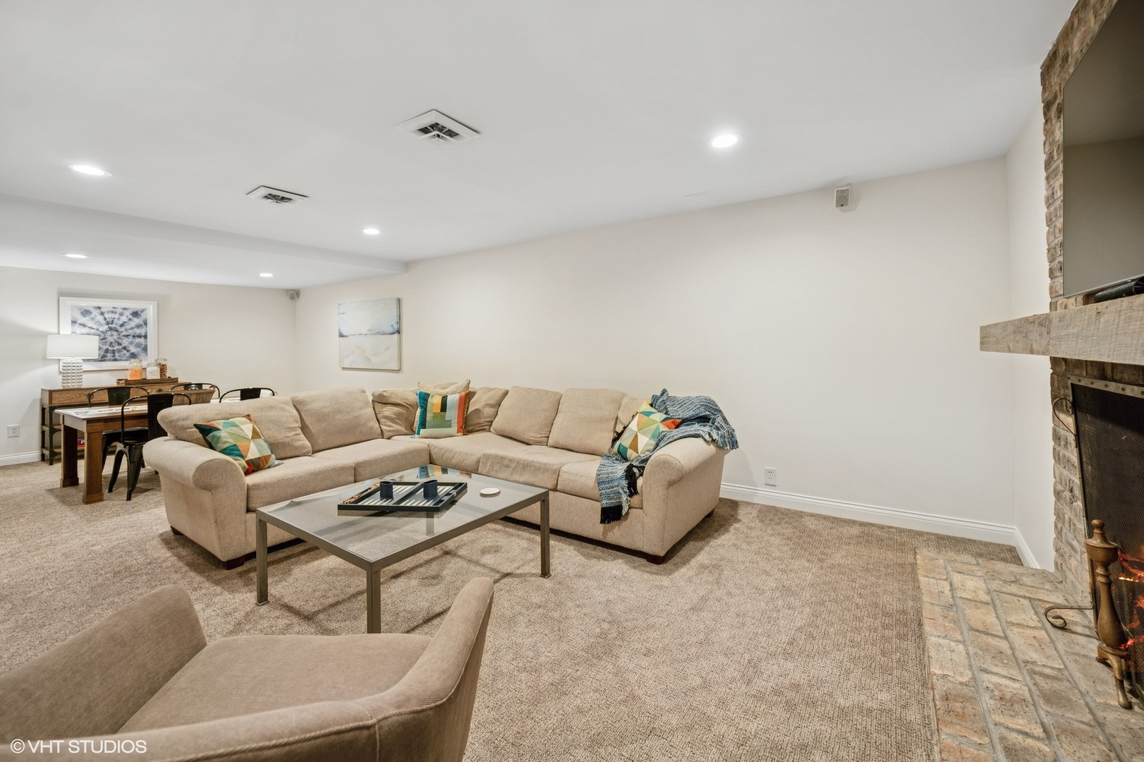 770 Prospect Avenue Winnetka, IL 60093 - Photo 32 of 50 a living room with furniture a fireplace and a flat screen tv