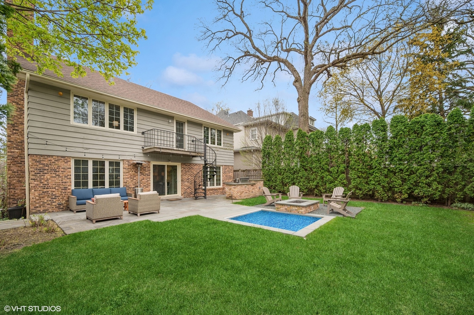 770 Prospect Avenue Winnetka, IL 60093 - Photo 37 of 50 a view of a house with a backyard and a patio