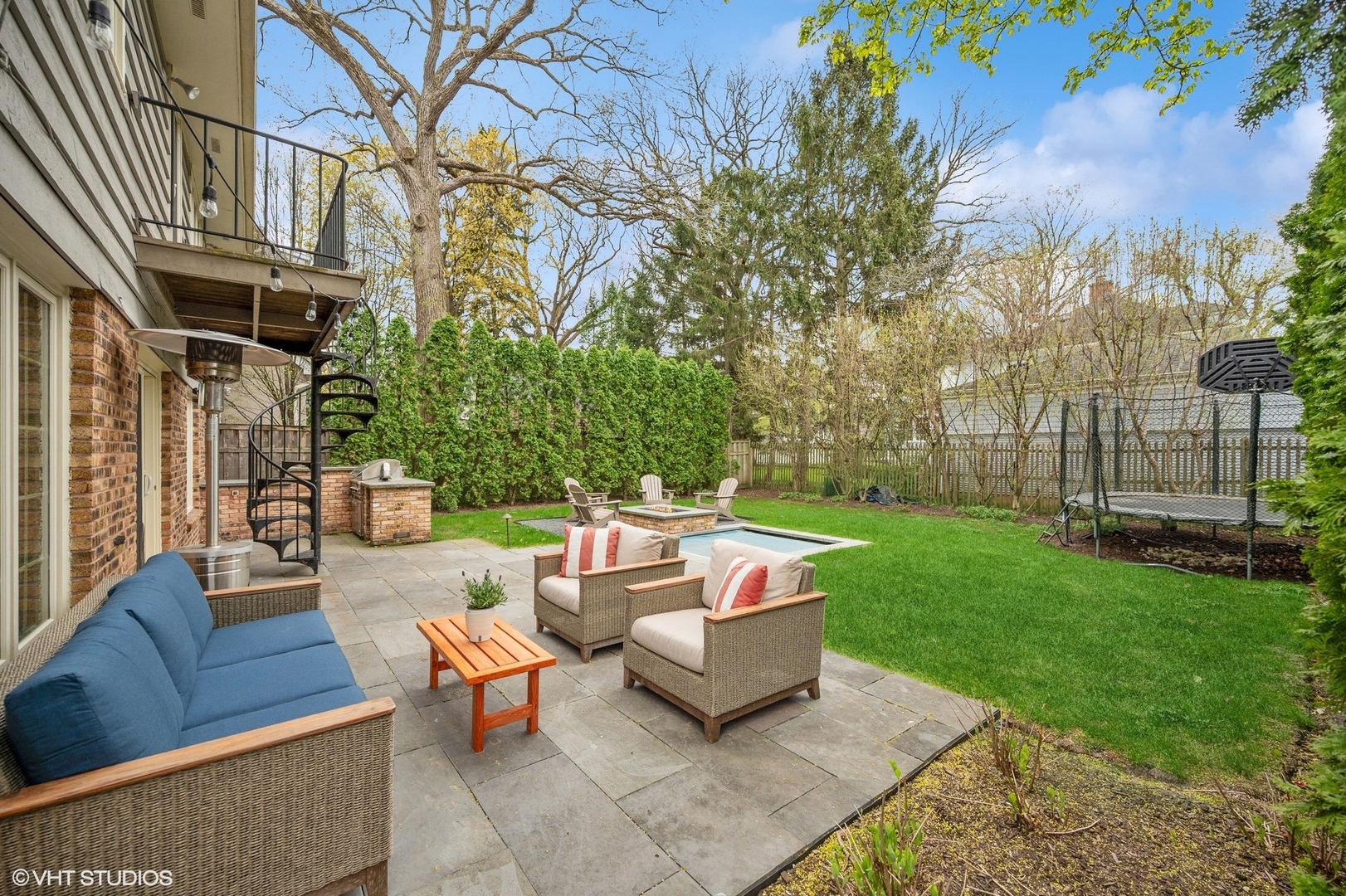 770 Prospect Avenue Winnetka, IL 60093 - Photo 39 of 50 a view of a backyard with couches potted plants and large tree
