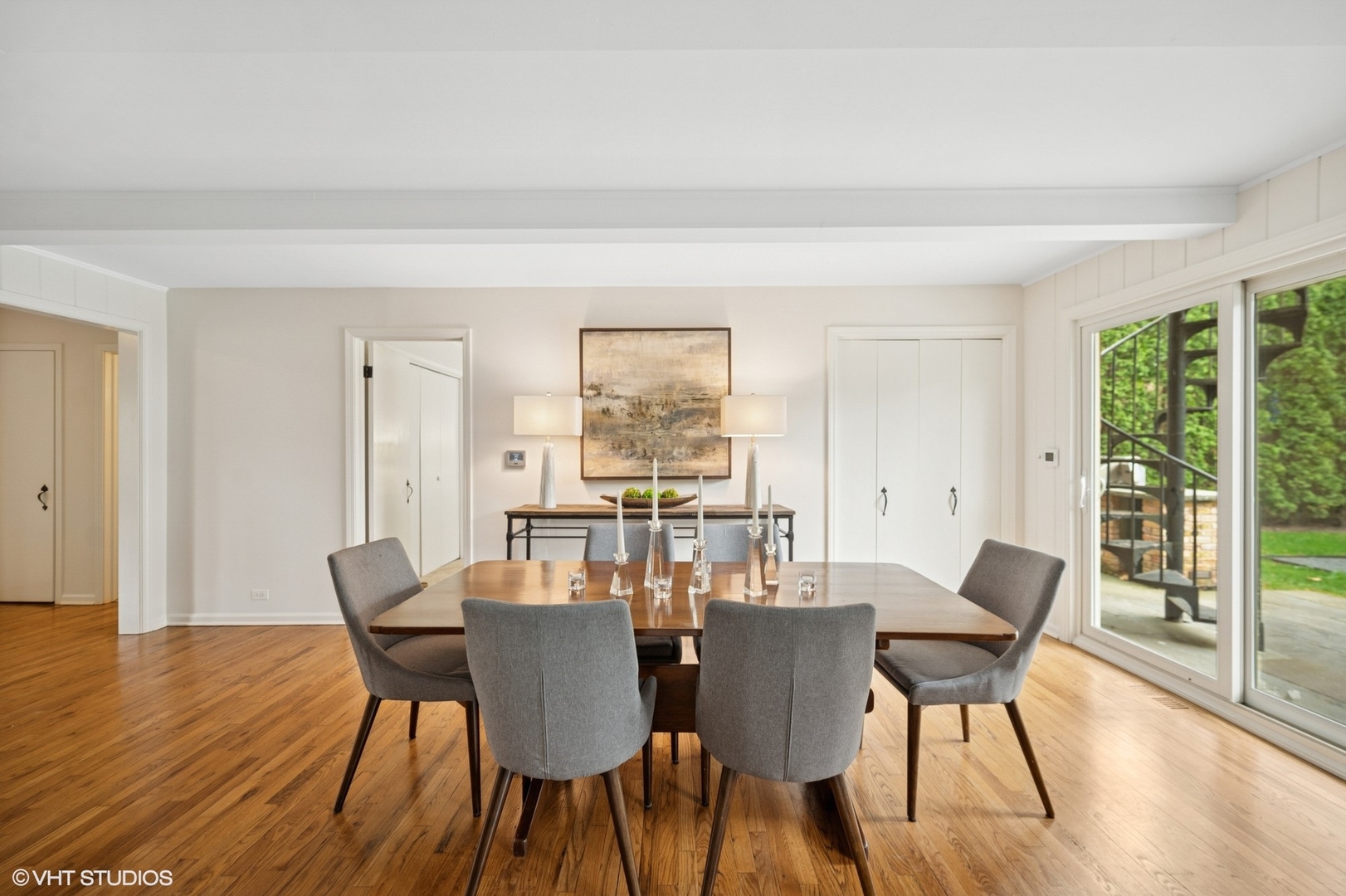 770 Prospect Avenue Winnetka, IL 60093 - Photo 6 of 50 a view of a dining room with furniture large windows and wooden floor