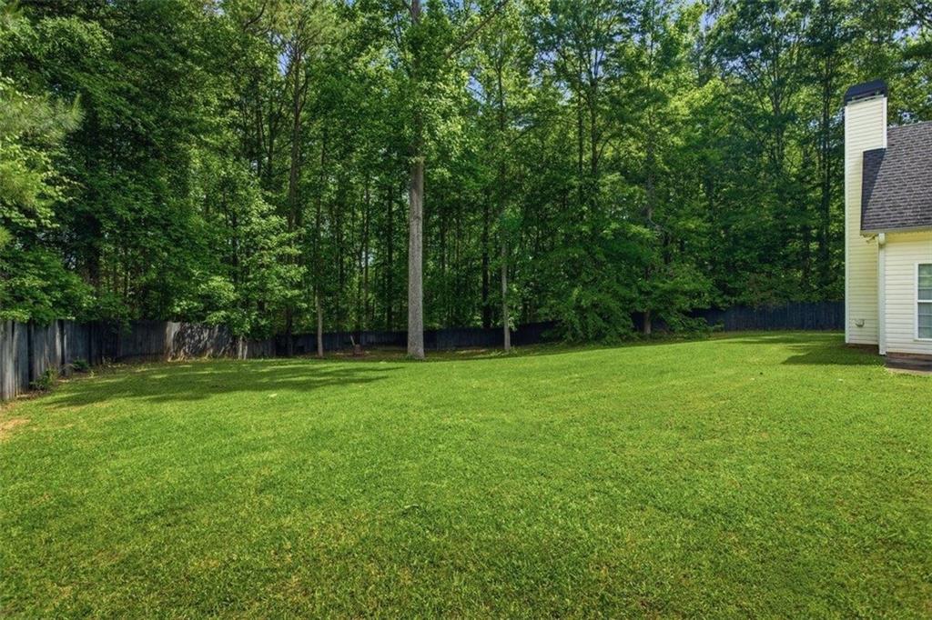 1231 Hillview Road Hampton, GA 30228 - Photo 41 of 49 a view of a backyard with a trees