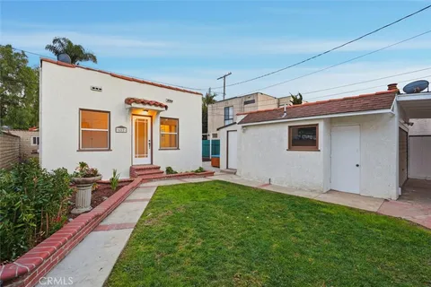 a view of backyard with a patio
