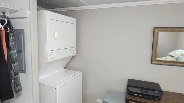 a view of a sign in a yard with flower plants